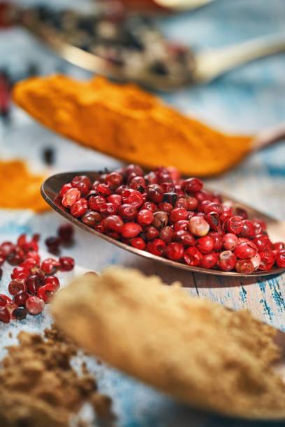 Variation of Spices Turmeric, Ground Ginger and Red Peppercorns