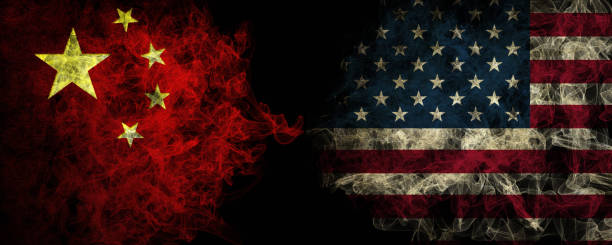 istock Chinese and American smoky mystic flags placed side by side. Densely colored silk smoke flags of China and the United States of America... 2177307100