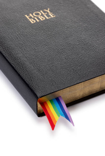 istock Close Up Bible with LGBTQ Rainbow Ribbon Isolated on White 2177308429