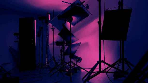 istock Photo or Video production studio with professional equipment preparation before shooting. Studio LED continuous lights arranging behind diffuser plates for softer light to the product and background. 2177309266