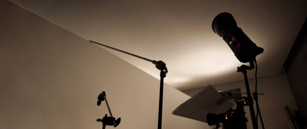 istock Photo or Video production studio with professional equipment preparation before shooting. Studio LED continuous lights arranging behind diffuser plates for softer light to the product and background. 2177309272