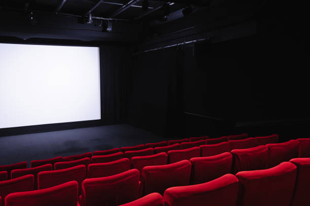 istock Cinema blank wide screen and empty red chairs 2177310802