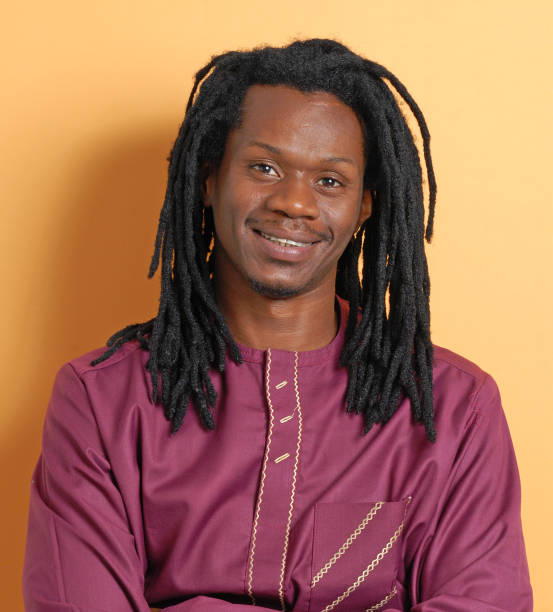 istock African Rastafarian man portrait on orange background. 2177311767