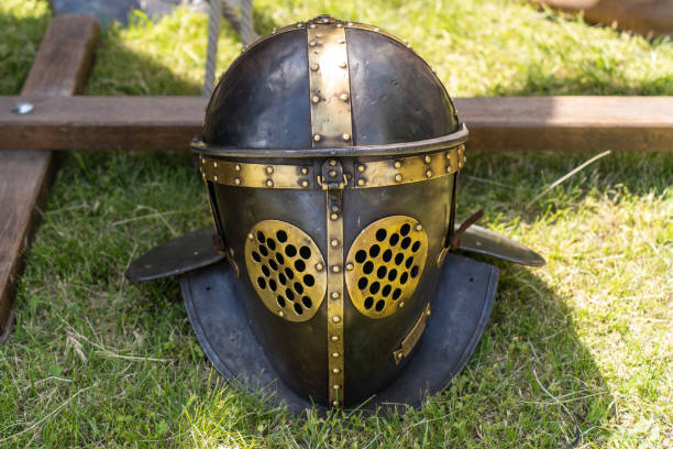 istock Ancient Roman gladiator helmet in a military camp 2177313347