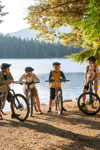 istock Family with bicycles pause on lakeshore 2177314532