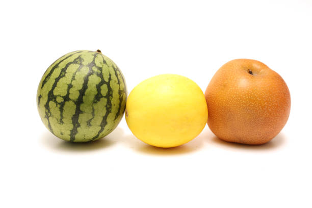 Small watermelon and pear,melon isolated on a white background.