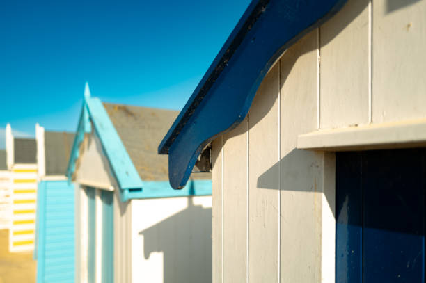 Pastel painted beach side huts seen on a famous beach in Southwold, Suffolk, UK. Costing many thousands of pounds to buy.