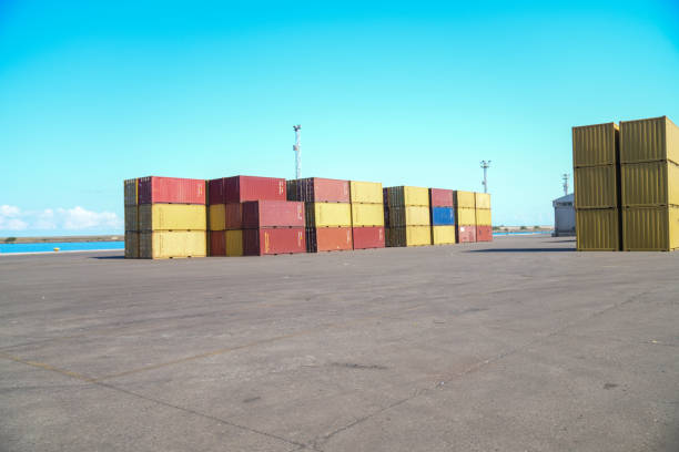 Stack of large colorful shipping containers at the dock at Bayonne New Jersey, busy east coast of USA shipping port.