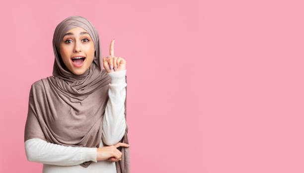 istock Emotional muslim girl having idea, pointing finger up, found problem solution 2177321769