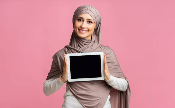 istock Happy Muslim Woman Holding Digital Tablet With Black Screen 2177321823