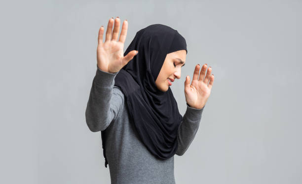 istock Scared muslim woman gesturing stop, trying to protect herself from abuse 2177322144