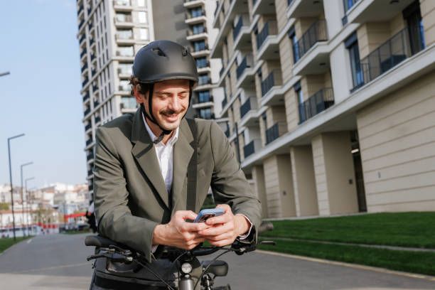 istock A cheerful businessman on a bike, staying connected commuting to work 2177323063