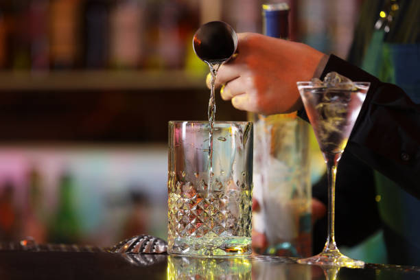 istock Bartender making fresh alcoholic cocktail at bar counter, closeup 2177324356