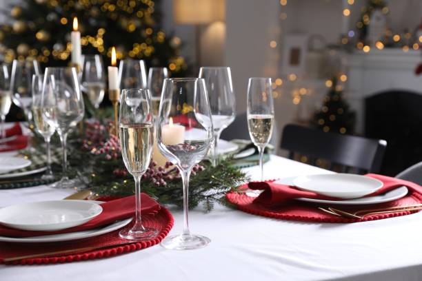 istock Christmas table setting with festive decor and dishware in room 2177324399