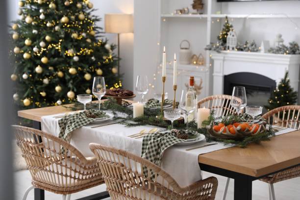 istock Christmas table setting with festive decor and dishware in living room 2177324401