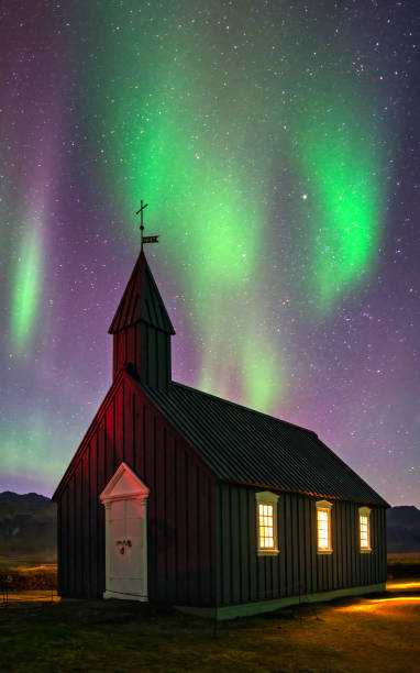 Northern Lights over a black church
