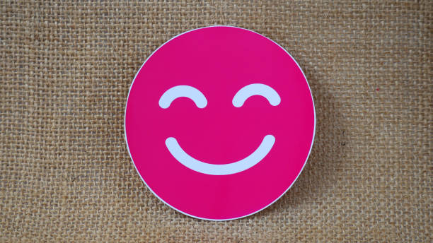 istock pink smile emoji on burlap 2177328584