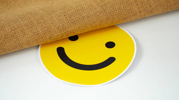 istock pink smiley emoji under classic burlap 2177328585