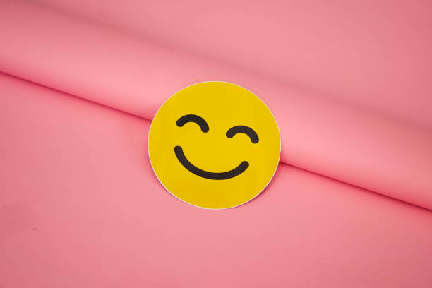 istock Yellow smiling emoji on aesthetic pink background 2177328712