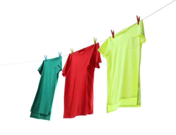 istock Colorful t-shirts drying on washing line isolated on white 2177329117