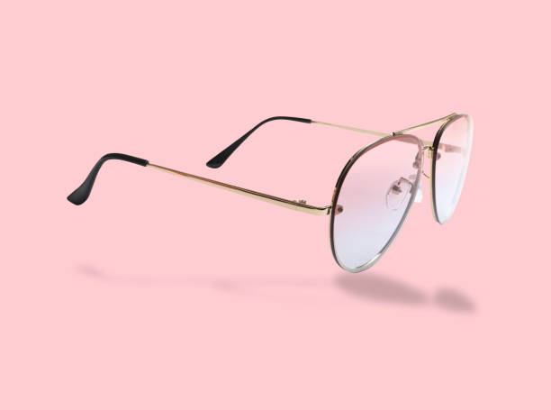 istock Stylish sunglasses in air on pink background 2177329122
