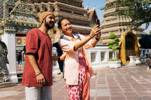 istock Happy tourist couple taking selfies while exploring ancient architecture on vacation 2177329173