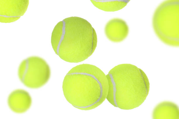 istock Many tennis balls flying on white background 2177329264