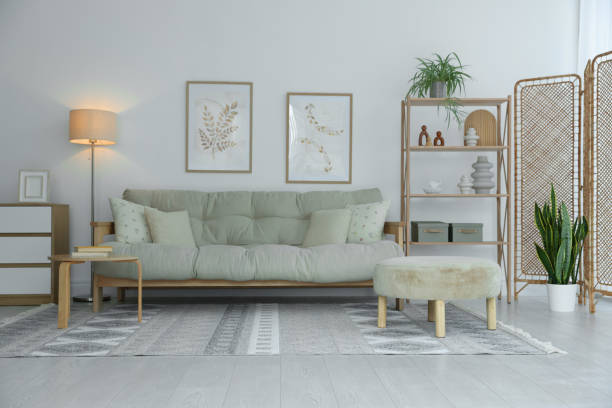 istock Stylish living room with folding screen and sofa. Interior design 2177329313