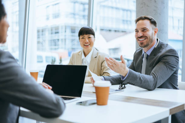 istock Formal office discussion with happy employees 2177333123