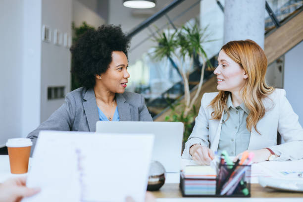 istock Employee conversing with a colleague in office 2177333130