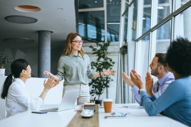 istock Team celebrating with applauding businesswoman 2177333164