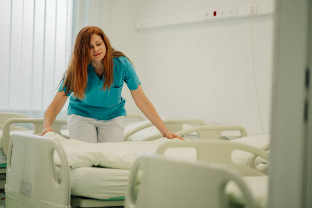 istock Healthcare Worker Adjusting Bed in Clean Hospital Environment 2177334608