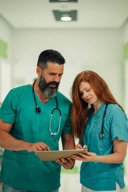 istock Medical team interpreting patient data on a clipboard in hospital 2177334615
