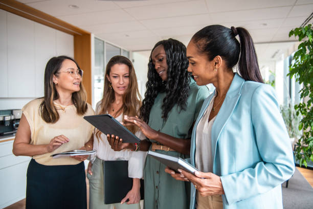 istock Diverse Team of Businesswomen Using Tablet in Office Setting 2177334956