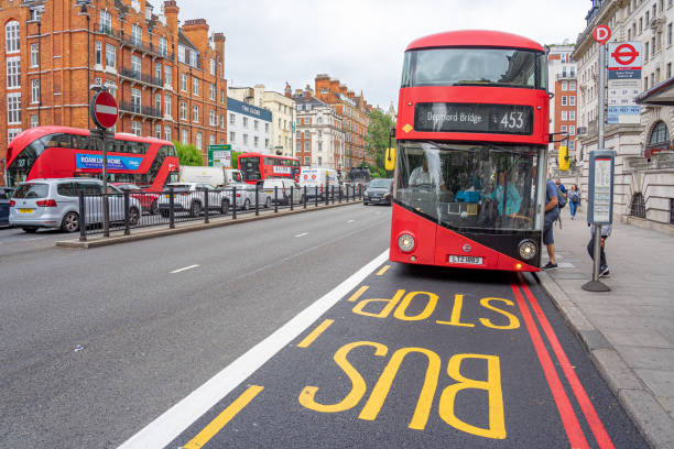 double decker bus arriving at stop, route Deptford bridge 453 in London
