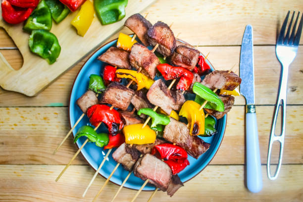 istock grilled beef skewers and peppers on a wooden table 2177335356
