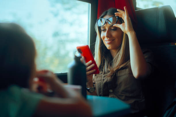 Lady Taking off Eyeglasses for reading up Close on Mobile Phone