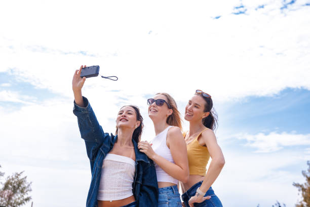 istock Group of friends taking a selfie with a disposable camera 2177338949