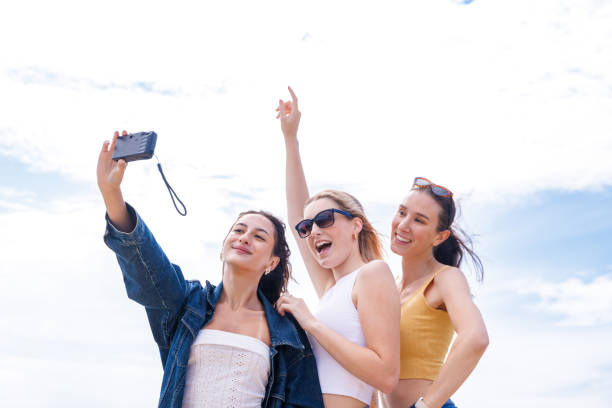 istock Group of friends taking a selfie with a disposable camera 2177339072
