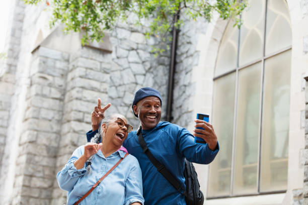 istock Senior African-American couple on vacation taking selfie 2177343876