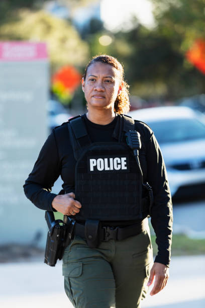istock Mature multiracial policewoman patrolling on foot 2177343918