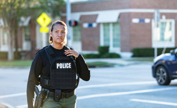 istock Mature multiracial policewoman patrolling on foot 2177343921