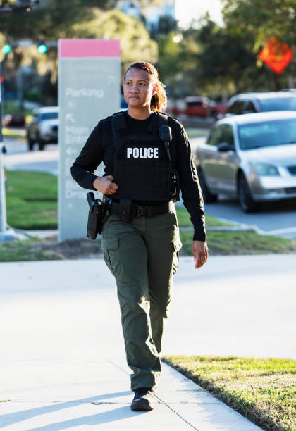 istock Mature multiracial policewoman patrolling on foot 2177343922