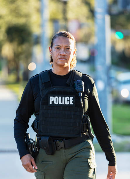 istock Mature multiracial policewoman patrolling on foot 2177343929