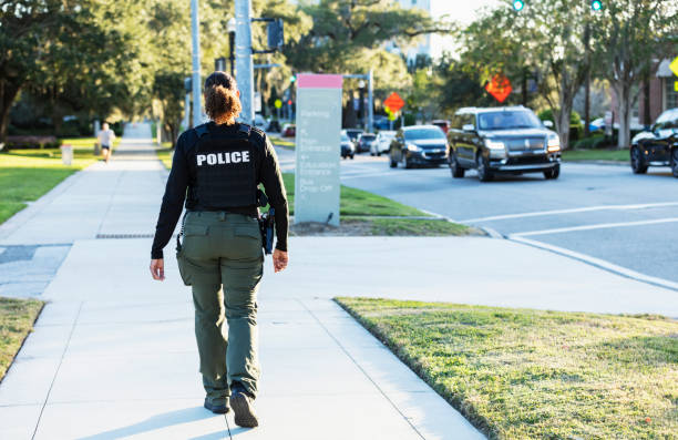 istock Mature multiracial policewoman patrolling on foot 2177343931