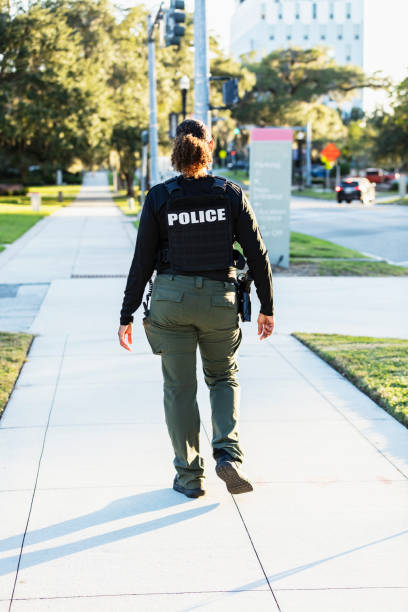 istock Mature multiracial policewoman patrolling on foot 2177343932