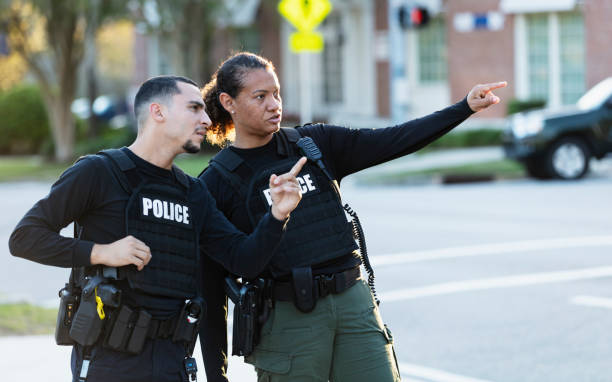 Two police officers patrolling community on foot