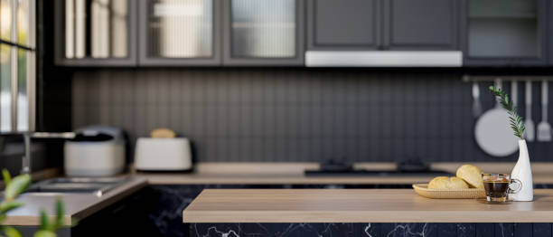 istock A modern kitchen island with a wooden top in a sleek black kitchen. home kitchen, home interior 2177344541