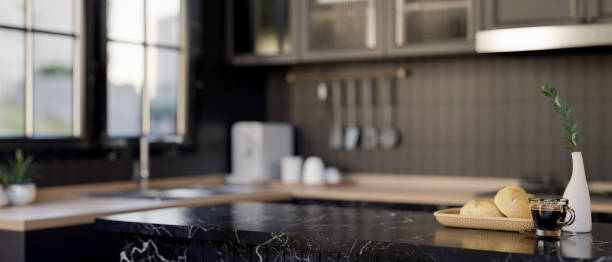 istock A display space for products on a modern black marble kitchen island in a sleek black kitchen. 2177344543