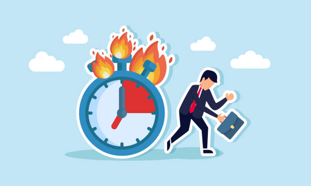 istock A businessman walking beside a burning clock, feeling tired and frustrated, illustrating exhaustion from overworking beyond time limits. 2177345416